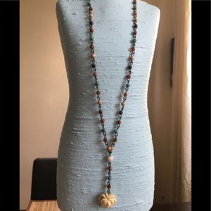 Multicolored beaded necklace with a flower